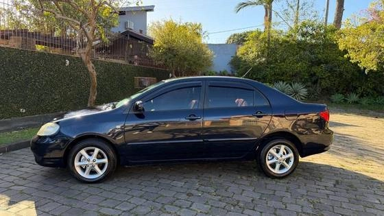 imagem-https://www.socarrao.com.br/sc-vehicle-images-prod/3451243/1787744658981-toyota-corolla-1.8-seg-16v-gasolina-4p-automatico-wmimagem08585483289.jpg