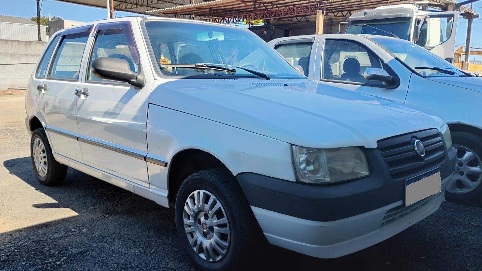 Fiat Uno Mille 1.0 Fire/ F.Flex/ ECONOMY 4p na cor Branco em Campo Largo / PR - 52041