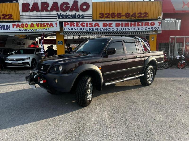 Mitsubishi L200 OUTDOOR HPE 2.5 4x4 CD T.Dies. Mec. na cor Vermelho em Curitiba / PR - 54770